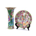 A 19th century Cantonese vase with a flared rim, the body richly decorated with bright enamels,