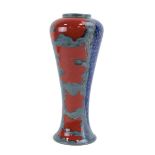 A Cobridge Toneware stoneware vase, the ground with red, blue and metallic glazes, marked PAS, KR,