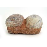 A pair of fossilised (?)dinosaur eggs, w.