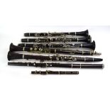 A group of six various French, British and Spanish clarinets including a cased Boosey & Hawkes