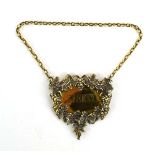A late 20th century silver gilt decanter label for sherry, relief decorated with fruiting vines,