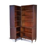 A pair of Regency and later mahogany waterfall-style bookcases with adjustable shelves,