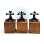 A group of three beech cased vintage student's microscopes by C.