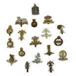 A group of eighteen cap badges relating to cavalry regiments including King Edward's Horse, BADS,