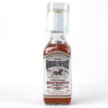 A bottle of Old Huckleberry Kentucky Bourbon Whiskey with gift tumbler,