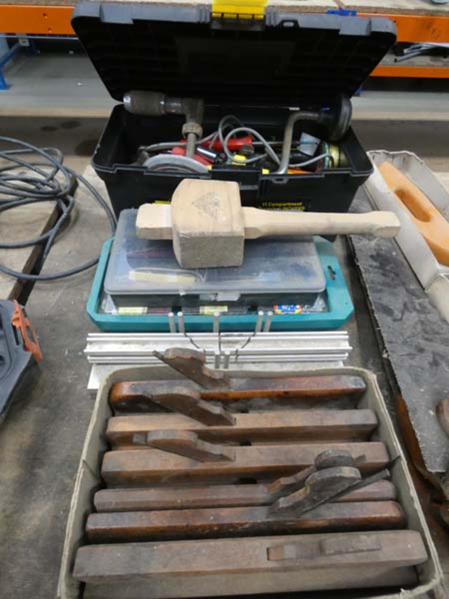 Quantity of assorted wood working tools incl. wooden planes, saws, mitre block, hammer, hand