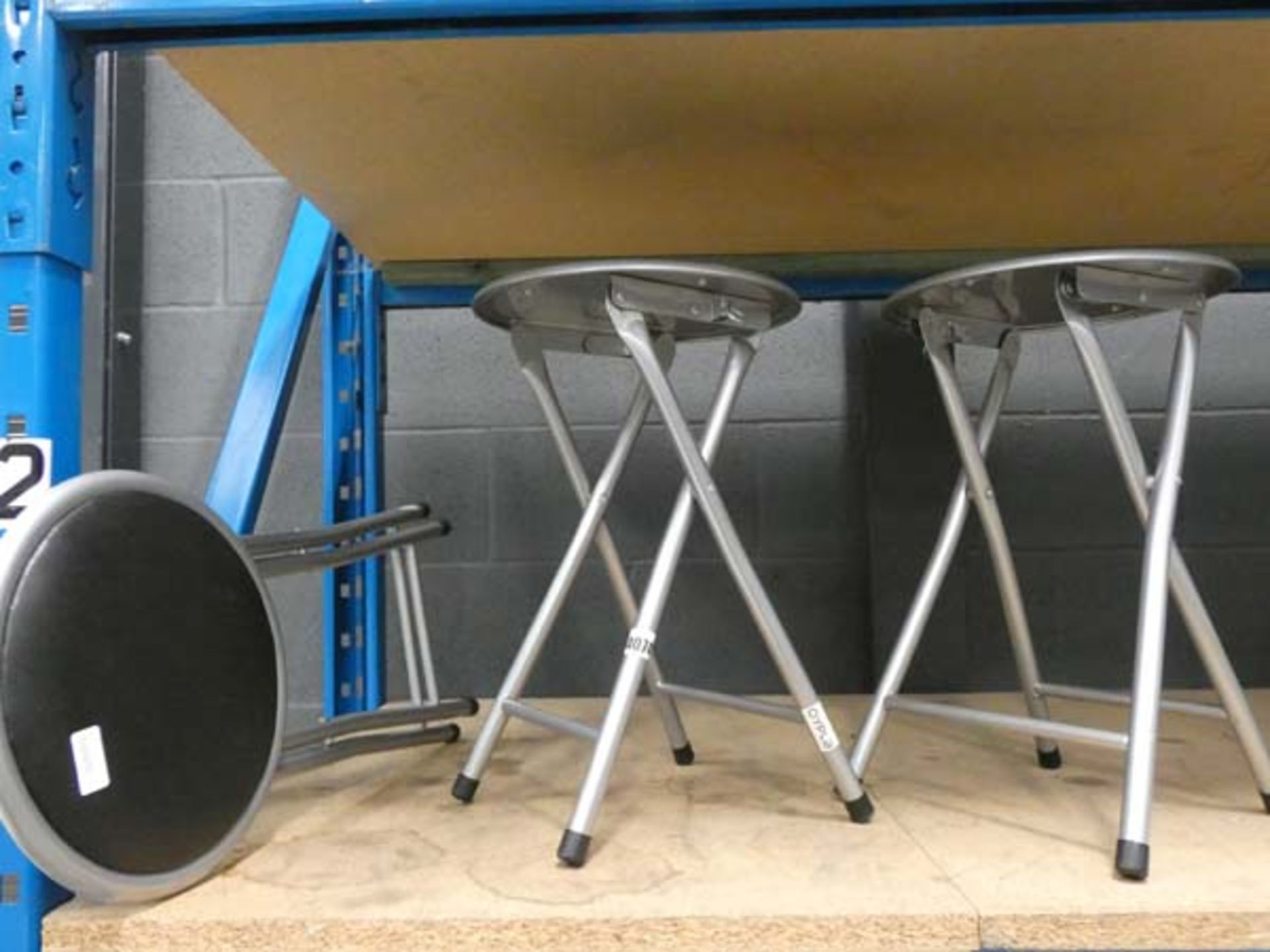 3 small silver and black stools