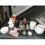 A cage containing coasters, Wedgwood trinket box, Halcyon Days pill box, ornamental figures and jugs