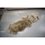 Pale brown sheepskin rug, approx. 190cm x 70cm