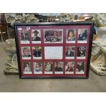 Framed and glazed collection of autographed postcards of the Eastender's cast (unverified)