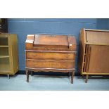 Continental walnut finish and strung serpentine front bureau