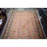 Louis De Poortere Amerigo carpet with salmon pink ground and flower design, approx. 240cm x 340cm