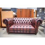 2 seater full button Chesterfield in oxblood leather