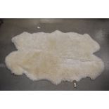 Cream sheepskin carpet, approx. 120cm x 200cm