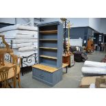 Grey painted pine bookcase with cupboard under