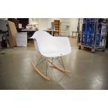 Modern Eiffel Tower style rocking chair with white moulded seat
