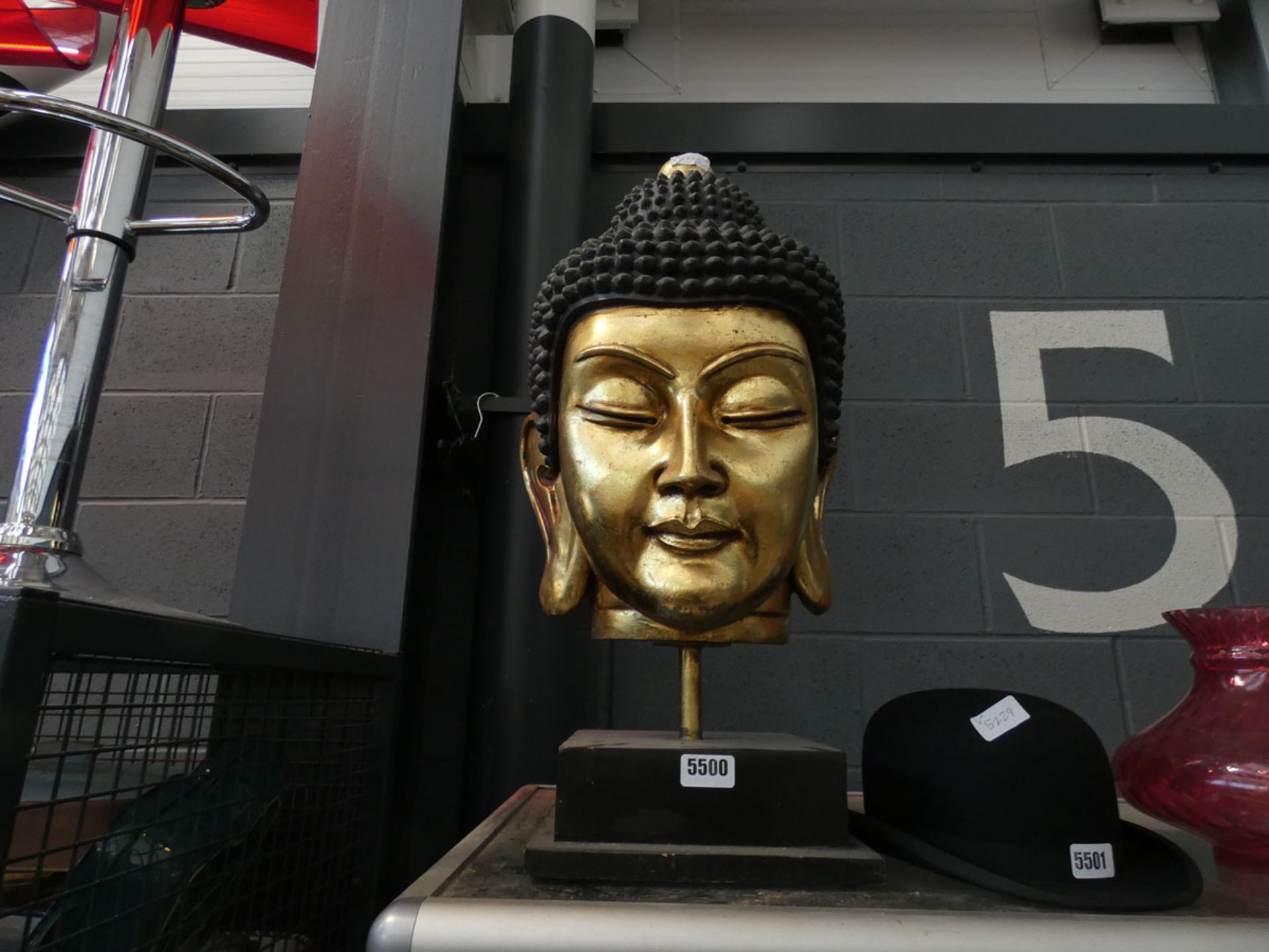 A gold painted Buddha's head