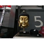 A gold painted Buddha's head