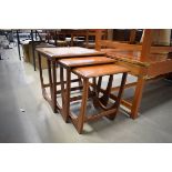 Nest of 3 G-Plan teak side tables, the largest table having a tiled surface