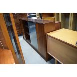 Shallow mahogany sideboard with 2 doors and 2 glazed sliding doors by Herbert E. Gibbs