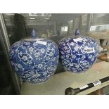 A pair of pumpkin shaped blue & white Oriental lidded pots