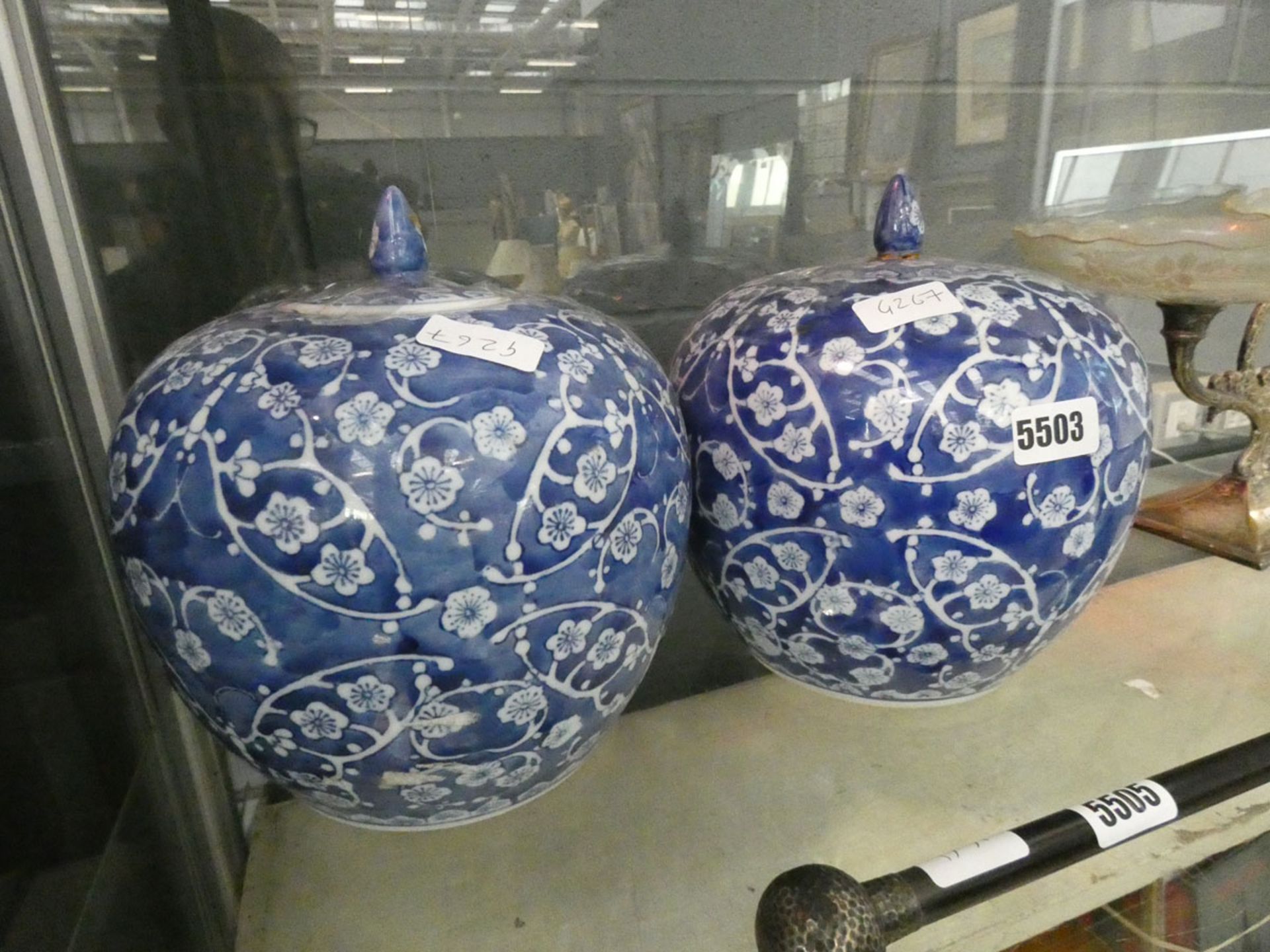 A pair of pumpkin shaped blue & white Oriental lidded pots