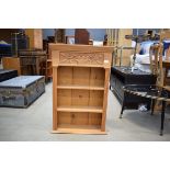 Modern pine shallow bookcase with floral carved decoration