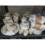 A cage containing: a quantity of Royal Doulton Harvest Garland pattern crockery