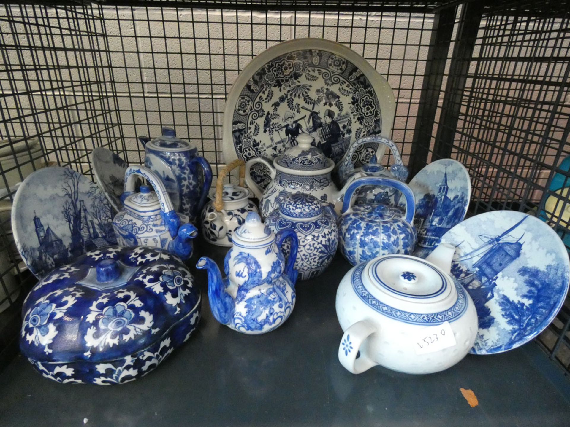 A cage containing: blue & white Delftware, plus a quantity of modern blue & white Chinese teapots