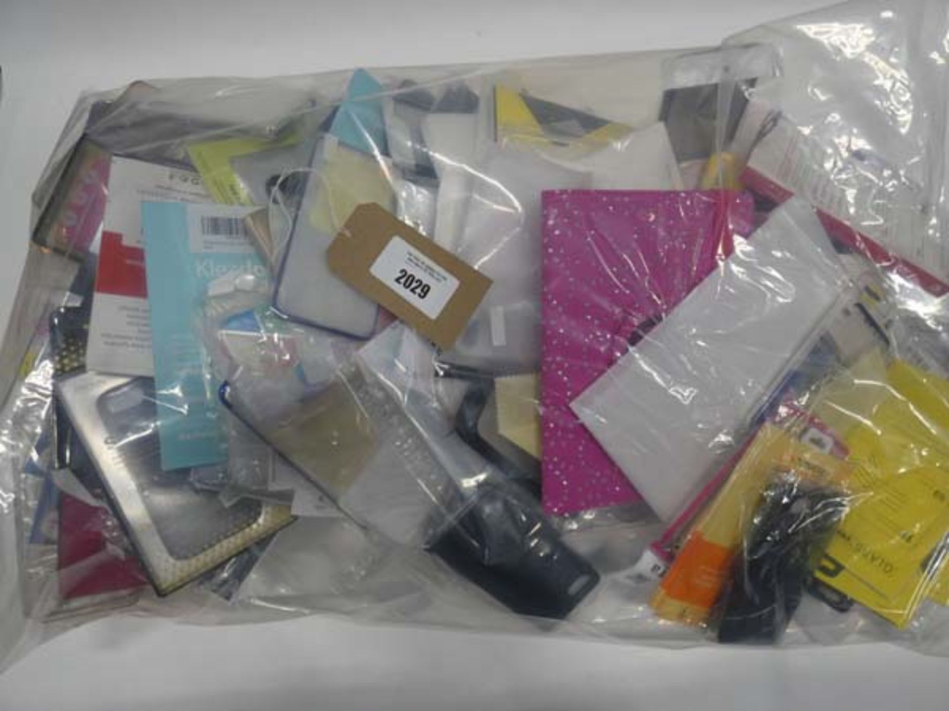 Bag containing quantity of mobile phone cases and covers