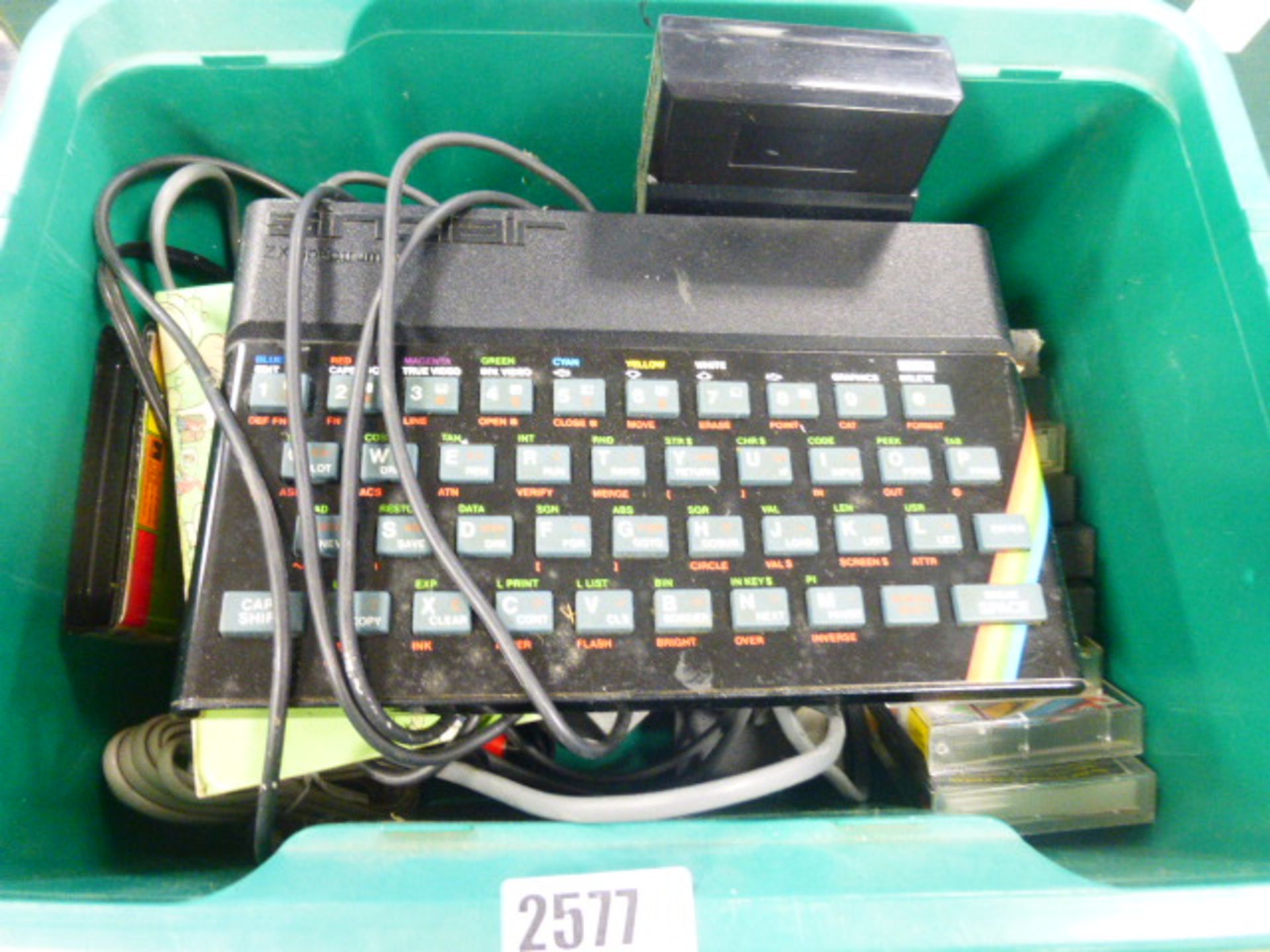 Sinclair ZX Spectrum with various cassettes, psu's and games