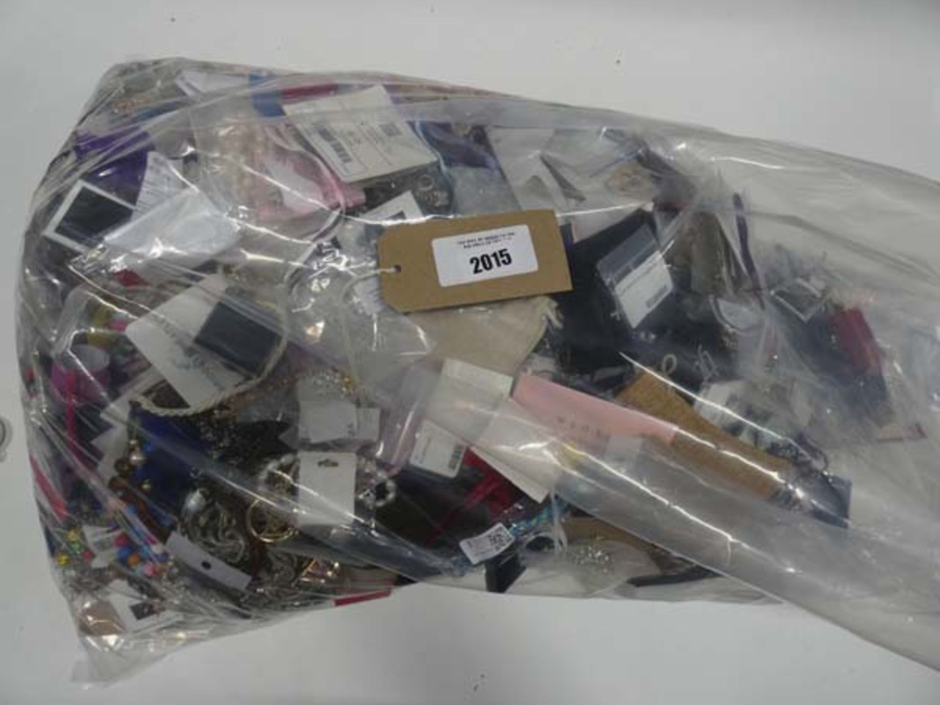 Bag containing large quantity of loose costume and dress jewellery