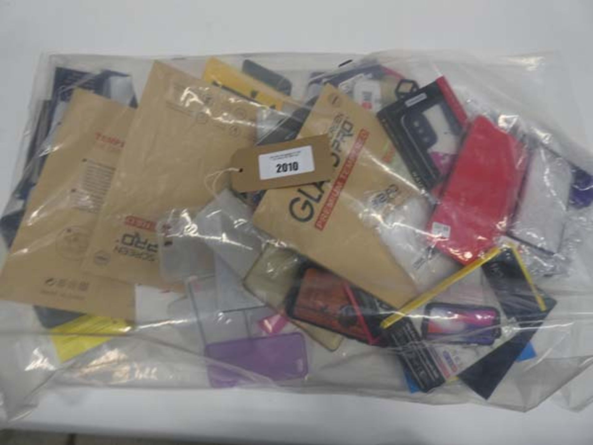 Bag containing quantity of mobile phone cases and covers