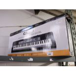 (2417) Boxed Casio keyboard with a Casio keyboard stand