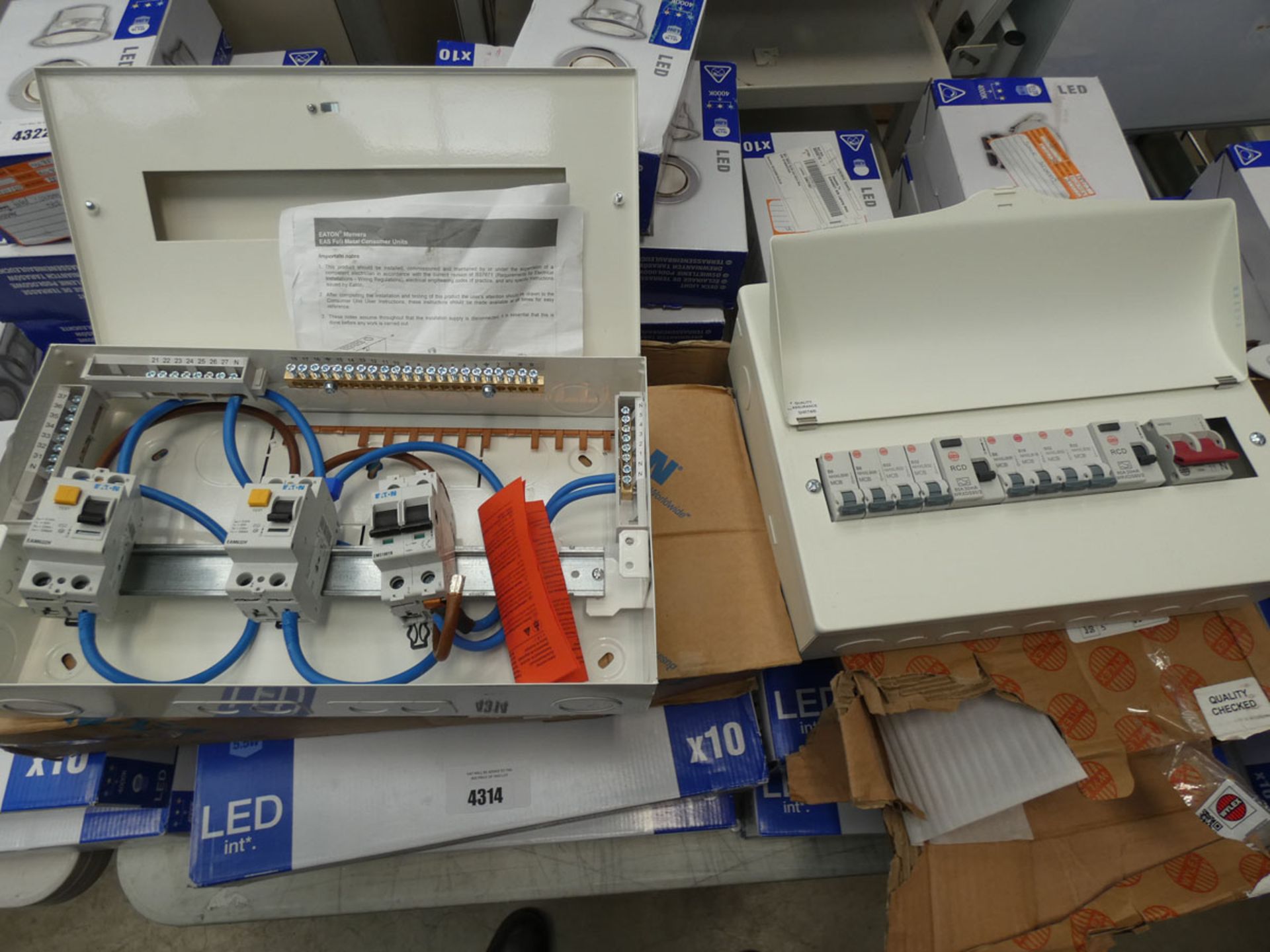 An Eaton and a Wylex consumer unit