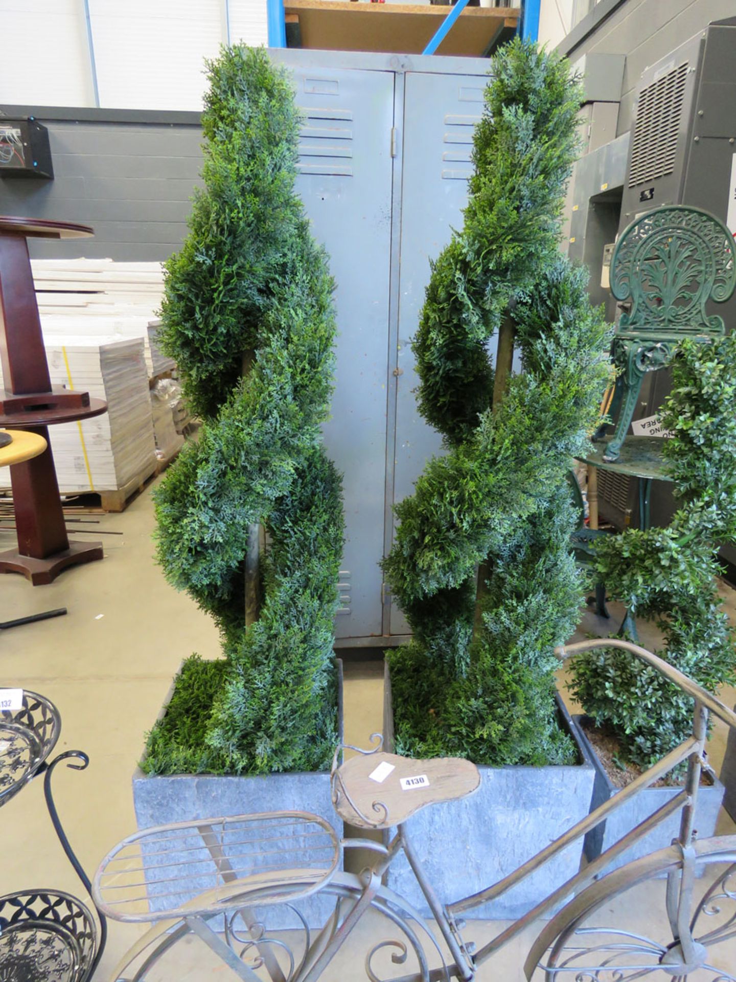 2 large artificial twisted conifers