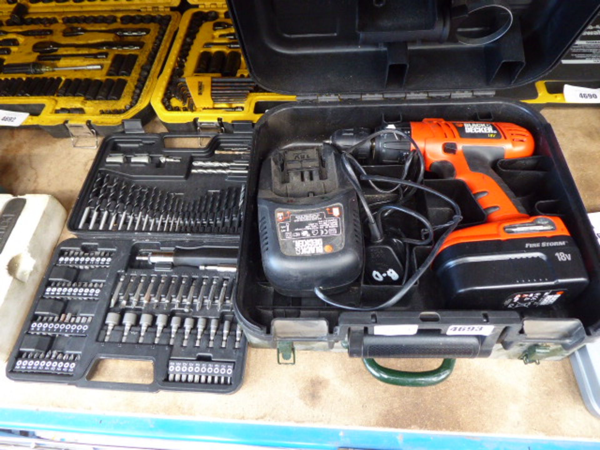 Small screwdriver bit set, Black & Decker drill and a green box containing a quantity of spanners