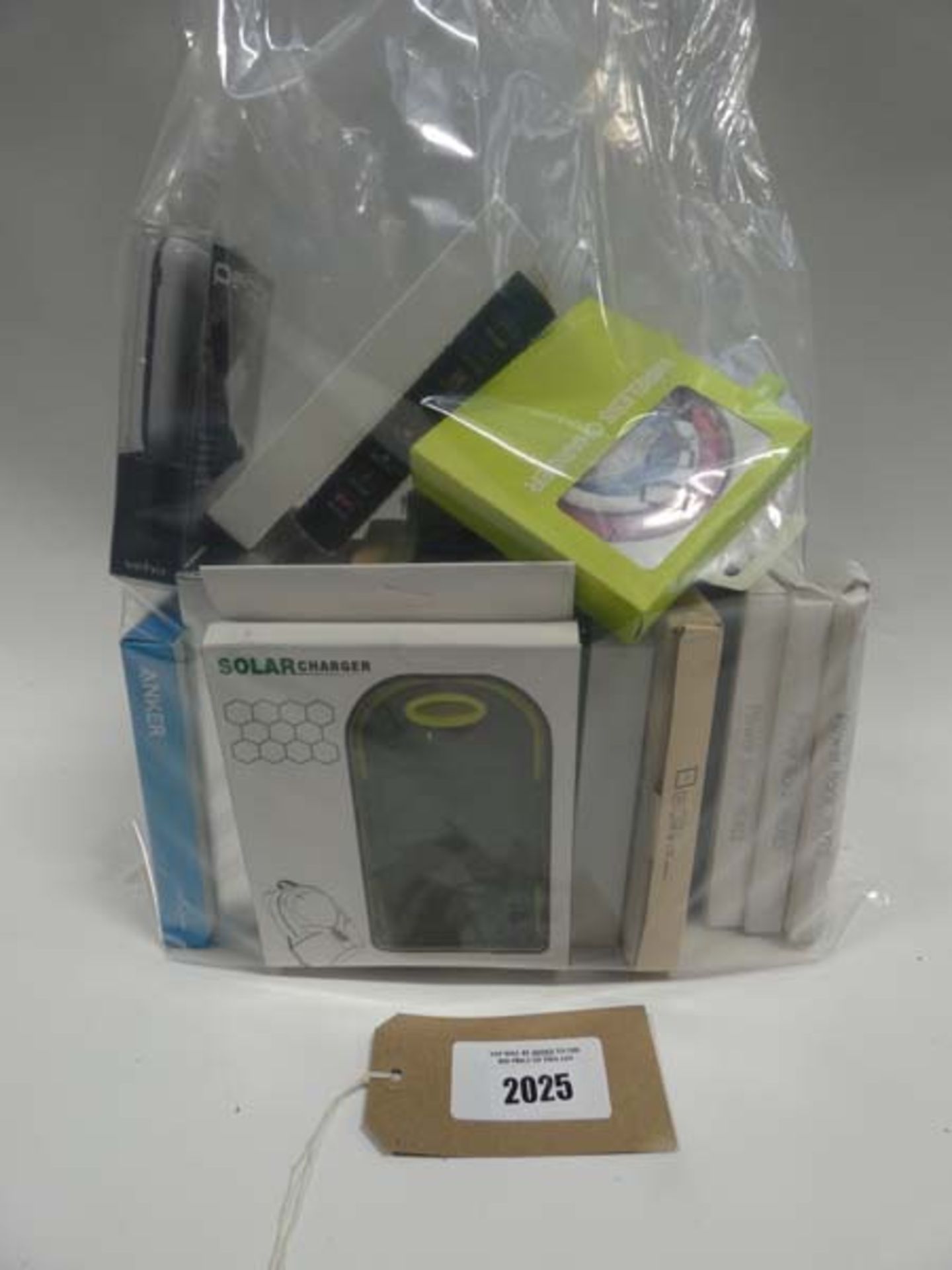 Bag containing quantity of portable power banks, wireless charging pads and battery case