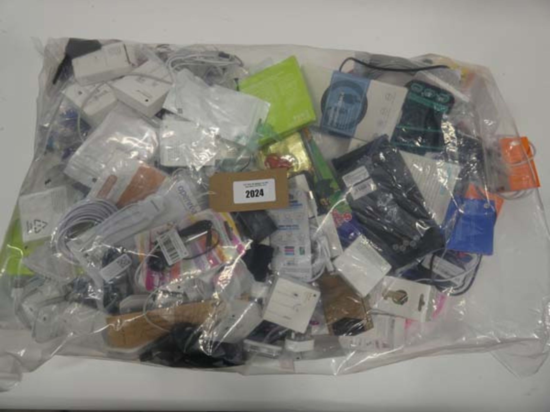 Bag containing quantity of mobile phone accessories; cables, leads, adapters, cases, earphones, etc