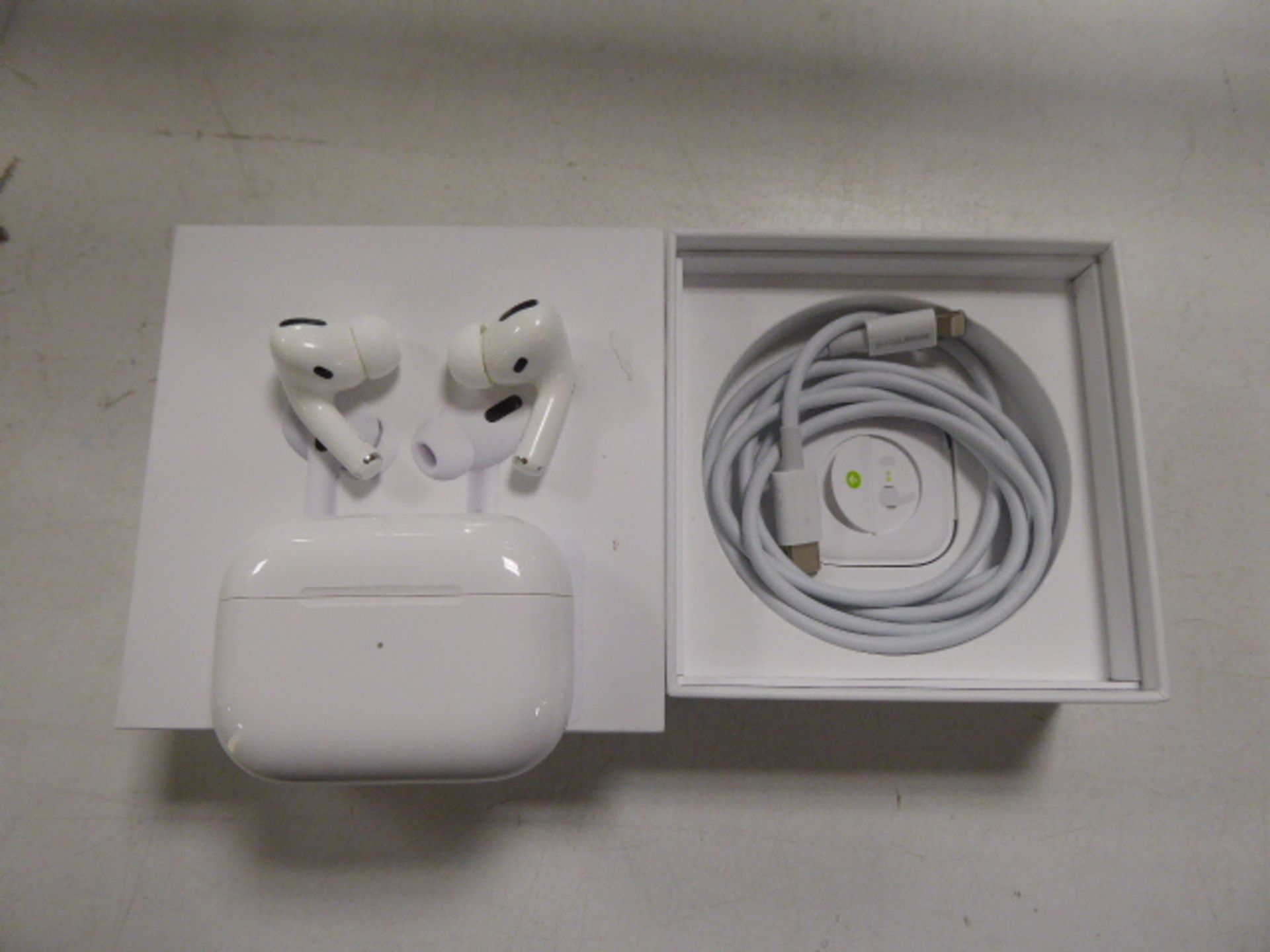 Pair of Apple Airpods Pro with wireless charging case and box