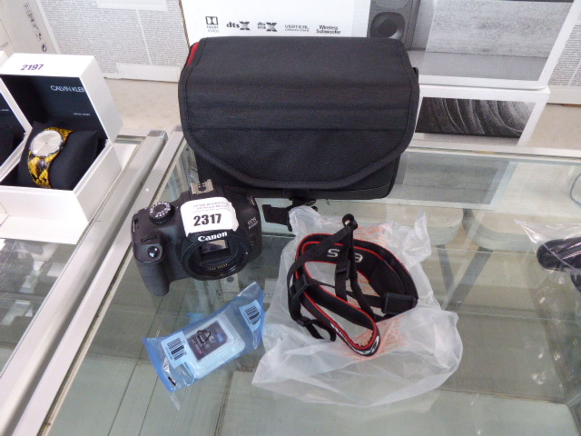A Canon EOS4000 camera, with 16gb memory card, carry case and strap