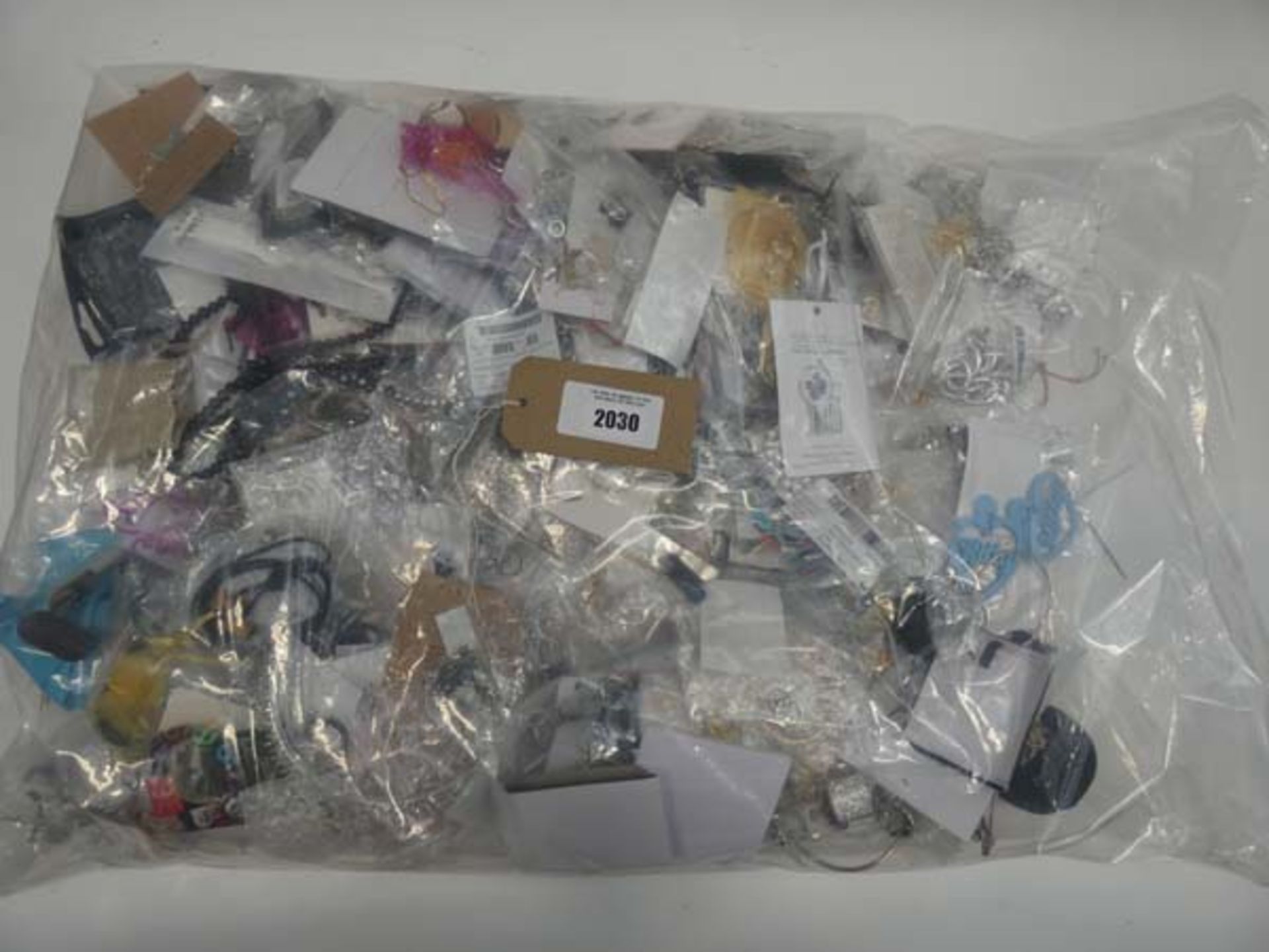 Bag containing quantity of loose costume and dress jewellery