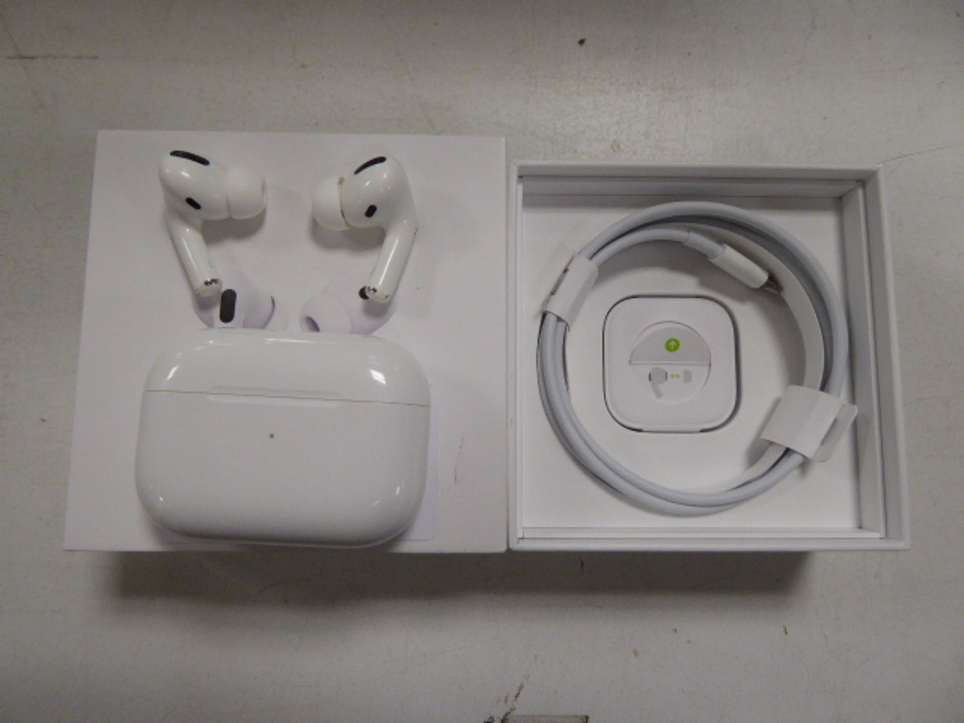 Pair of Apple Airpods Pro with wireless charging case and box