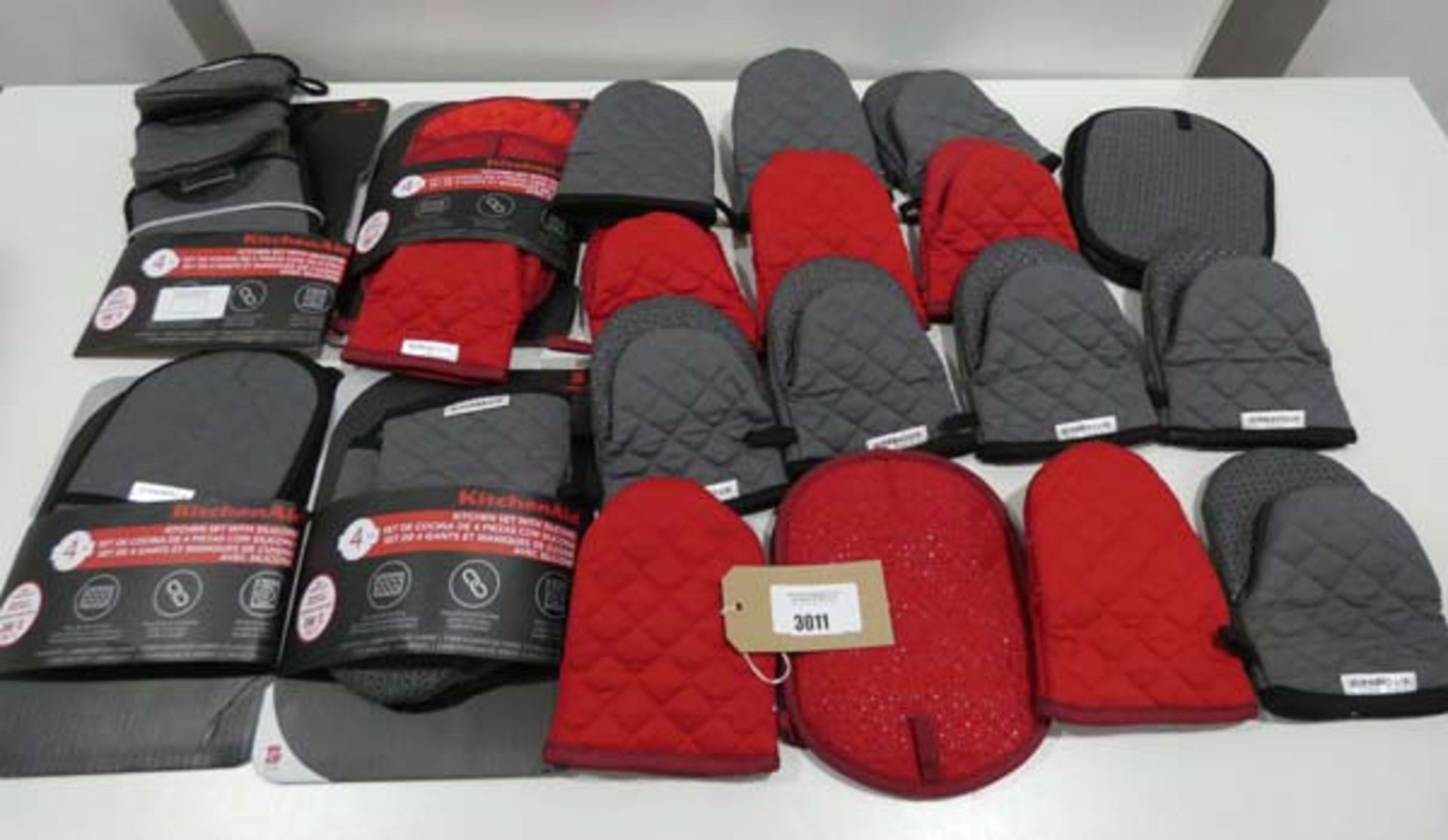 Bag of grey and red oven gloves