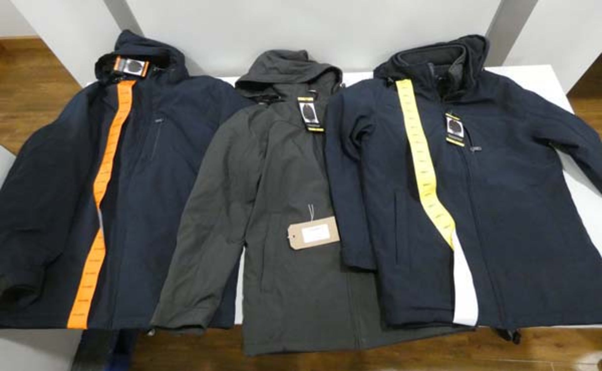 3 hooded waterproof jackets, 2 in blue and 1 in dark grey, sizes S, S, and XXL