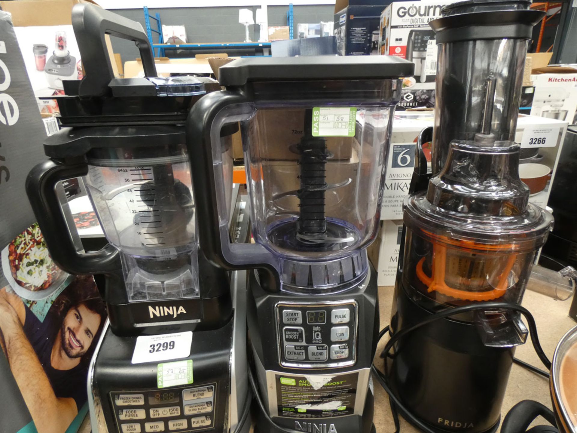 3094 - 2 Ninja blenders with assorted attachments and a Fridja juicer