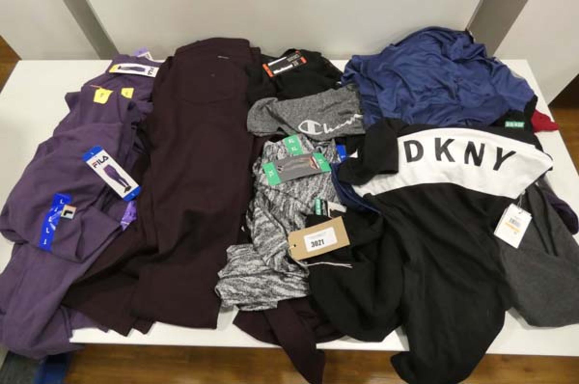 Bag of ladies mixed clothing to include Fila jogging trousers, DKNY and Champion, mixed sizes and