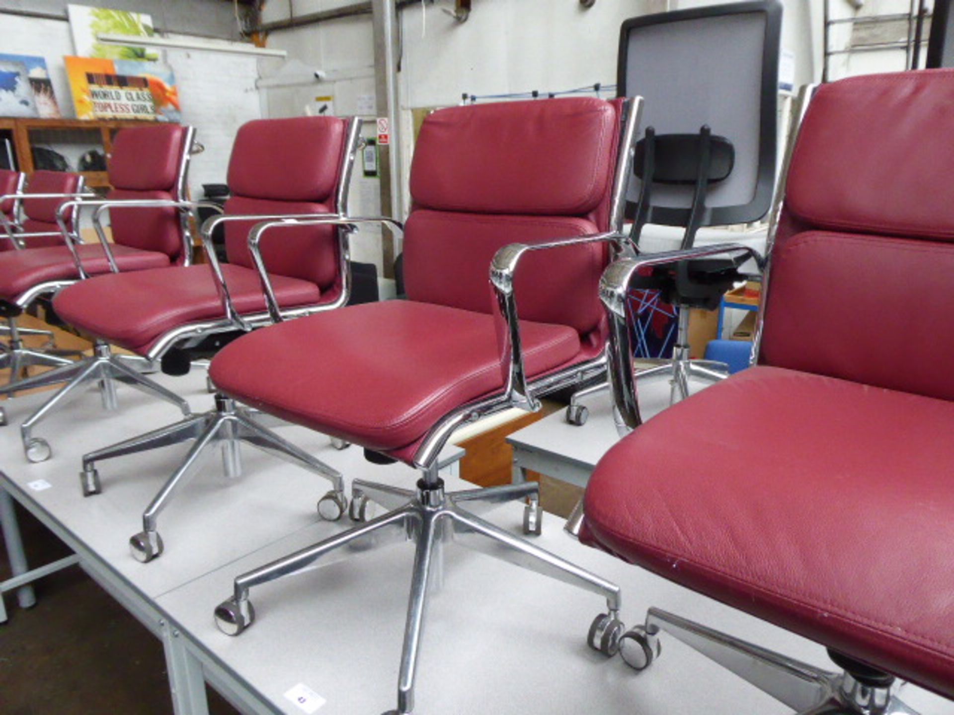 4 Milani Charles Eames style soft pad swivel armchairs in burgundy leather (4 with castors)