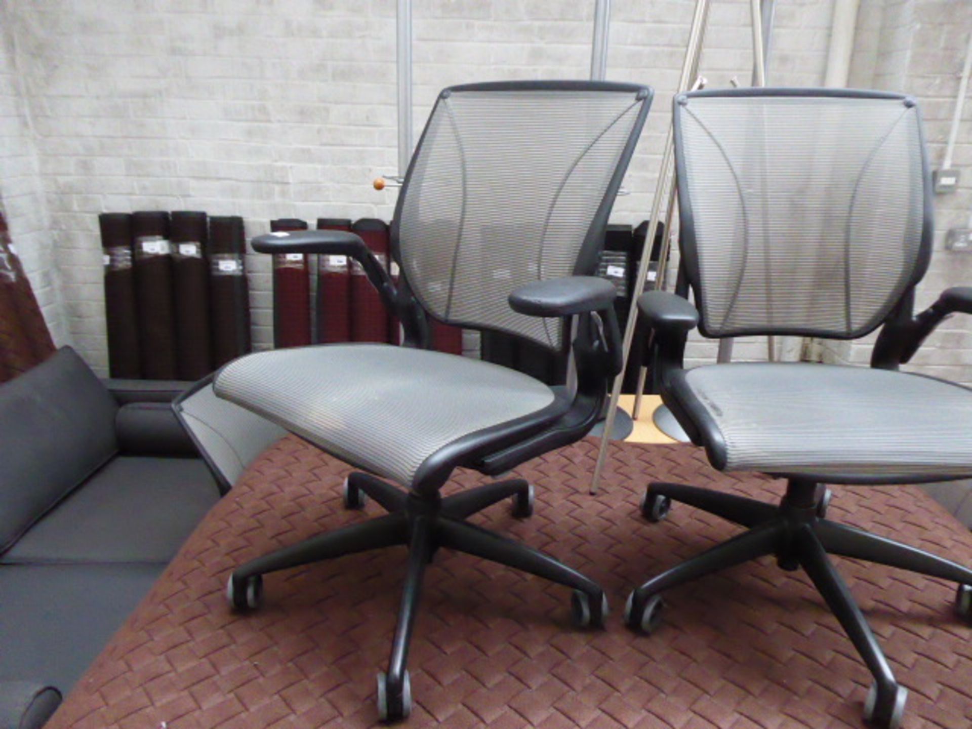 2 Humanscale black frame and grey mesh seat pad and back support swivel office armchairs