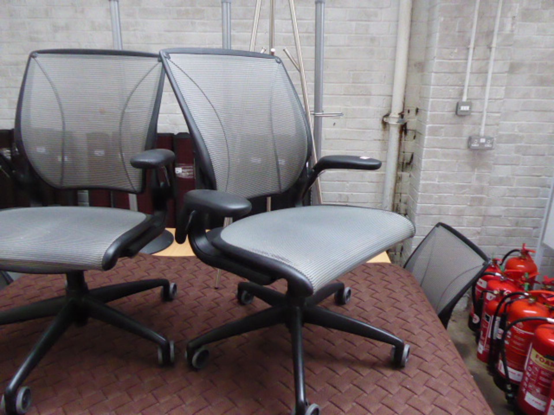 2 Humanscale black frame and grey mesh seat pad and back support swivel office armchairs